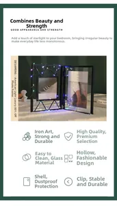 Detail of bifold metal photo frame with glass panels and decorative LED string lights