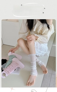Detailed view of breathable mesh ballet style leg warmers with delicate lace trim