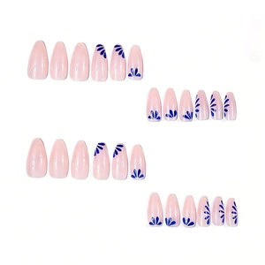 Long almond press-on nails with nude pink base and blue floral patterns in a 24pcs set