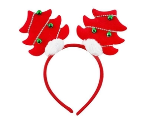 Detail of red Christmas tree headband with green bells and white plush balls on white background