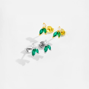 Close-up of S925 silver leaf earrings with pearl and green zircon in gold and silver
