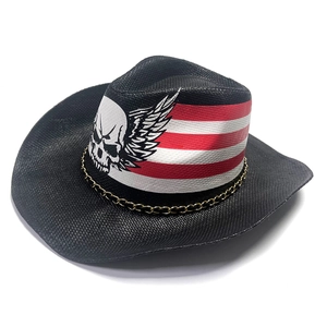Detail of black straw cowboy hat featuring golden chain and American flag skull print