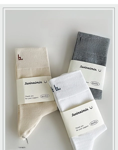 Three-pack of 90-degree heel cotton socks in beige, dark grey, and white colors
