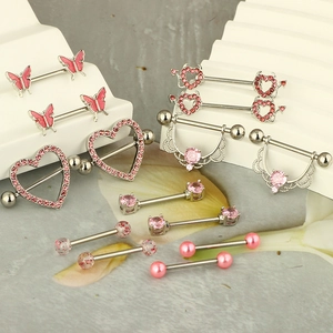 Pink zircon and enamel heart nipple rings set in polished stainless steel designs