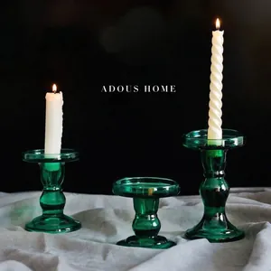 Three-piece set of green Roman pillar glass candle holders with elegant ribbed texture