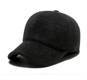 Detailed view of dark grey wool baseball cap with diagonal texture and SPORT metal logo