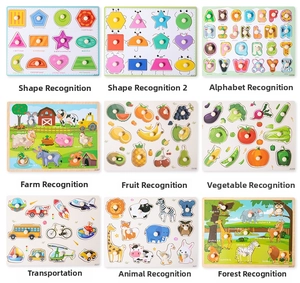 Detail view of 9 educational wooden peg puzzles including letters, shapes, and animals