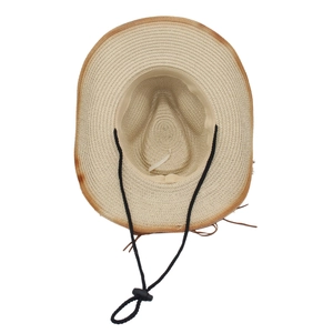 Detail of western straw cowboy hat featuring distressed edges and adjustable chin strap