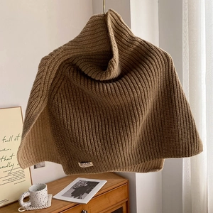Brown knit turtleneck neck warmer with stylish side split and woven brand label