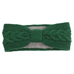 Close-up of cable knit bow headband in dark green with warm fleece lining texture