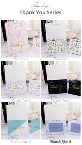 Detail showing six elegant gold-stamped thank you cards with floral and marble patterns