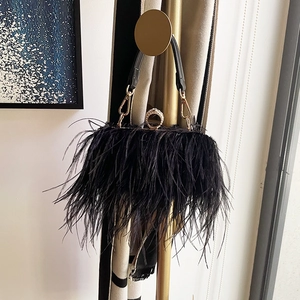 Elegant black faux ostrich feather clutch bag with rhinestone ring handle and shoulder strap