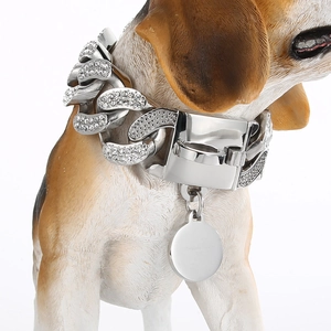 Macro view of silver cuban link dog collar with sparkling rhinestones and round dog tag