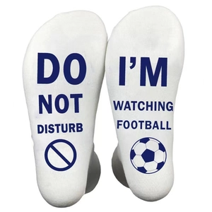 White cotton football socks with Do Not Disturb I'm Watching Football text on soles