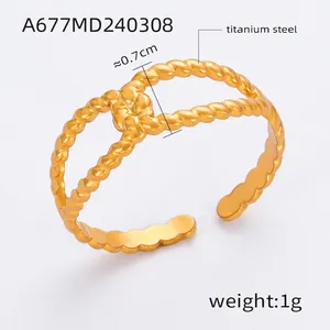 Macro view of gold-plated titanium steel cross twisted ring with 0.7cm width detail