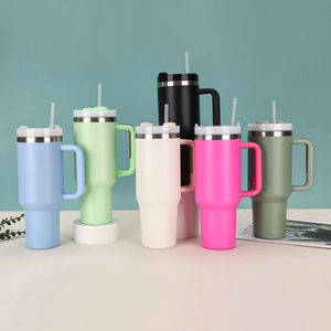 Group display of 40oz insulated travel mugs in six matte colors with straw and handle