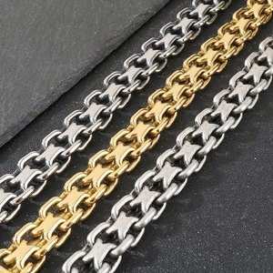 Close-up of 20mm industrial style X-link metal necklaces in gold, silver, and dark grey