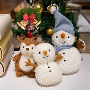Plush Christmas snowman and reindeer dolls arranged by a festive tree for holiday gifts