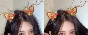 Detail of reindeer antler headband with brown ears and decorative forest elements