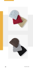 Detail of multi-color thick cable knit winter beanies with ribbed cuffs and warm texture