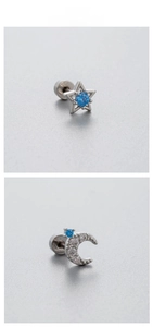 Détail macro de clous d'oreilles en titane étoile et lune avec zircon bleu et dos vissé