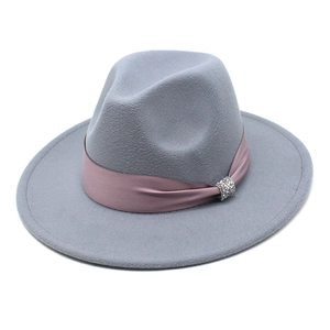 Close-up of wool fedora hat featuring a dusty purple felt finish and rhinestone buckle