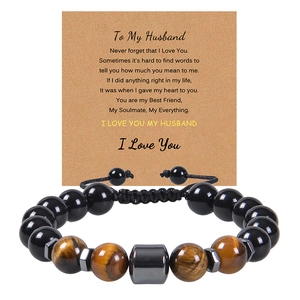 Detail of tiger eye bead bracelet for husband with a sentimental message card