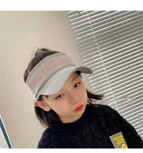 Detail of grey knitted sun visor for kids with pink SPORT lettering and mesh pattern
