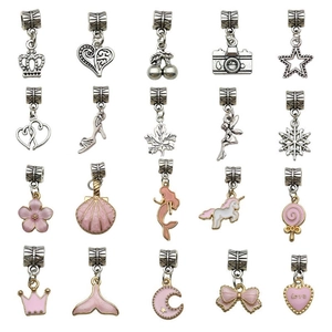 Detail view of 20 silver and pink enamel alloy pendants with diverse charm designs