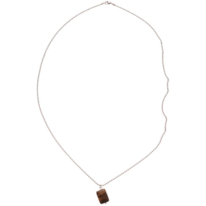 Ethnic vintage Tiger Eye stone pendant necklace with silver bead chain on white background