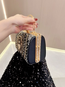 Luxury rhinestone evening clutch bag with gold handle and sparkling black diamond details