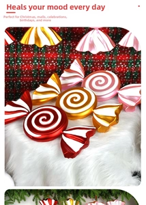 Macro shot of 55cm red, gold, and pink spiral candy ornaments for Christmas display