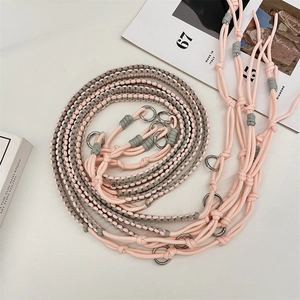 Detailed view of pink and grey hand-woven adjustable shoulder strap with silver metal rings