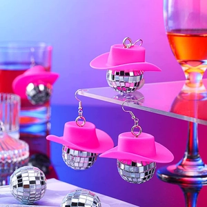 Pink cowboy hat and silver disco ball earrings for Y2K parties and festive events