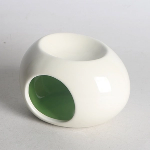 Minimalist ceramic aroma lamp with white exterior and green interior finish