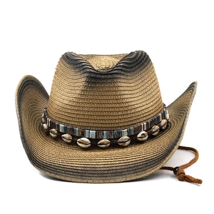 Detail of western straw hat featuring gradient brim edge and handmade seashell strap decoration
