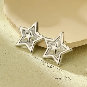 Detailed view of silver star earrings with dimensions 2.75cm and 10.5g weight info