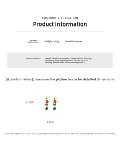 Detailed view of Chinese vintage earrings featuring 18K gold finish and resin pavilions
