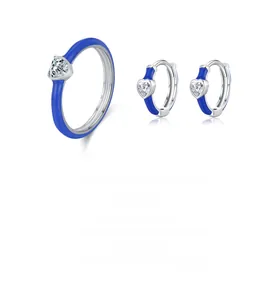 Detailed macro view of S925 silver jewelry set featuring blue enamel and heart zircon