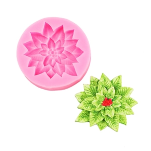 Detail showing pink silicone flower mold and green resin floral craft on white background