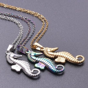 Detailed close-up of seahorse pendant necklaces in silver, gold, and rainbow finishes