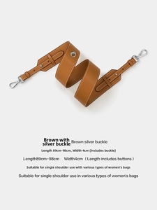Detail of brown leather replacement shoulder strap with white stitching and silver hardware