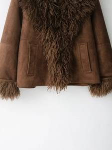 Detailed view of brown faux suede jacket with dark brown fur collar and cuffs decoration