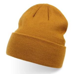 Detailed view of mustard yellow knitted beanie with fine ribbed texture and fold-up cuff.