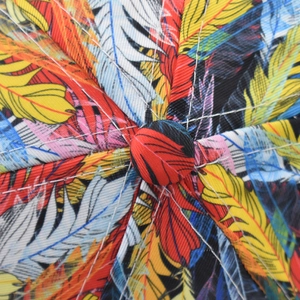 Detailed top view of a baseball cap showing vibrant leaf patterns and stitching craftsmanship