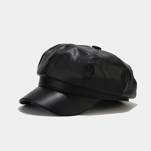 Detailed view of black PU leather octagonal newsboy cap with premium stitched panels