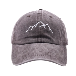 Close-up of white mountain embroidery on washed dark grey vintage cotton baseball cap