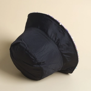 Detail of elegant black bucket hat featuring colorful sequins on the brim for party style