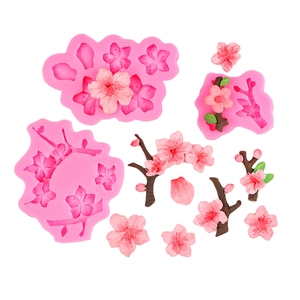 Pink silicone plum blossom mold set for cake decorating and DIY crafts on white background