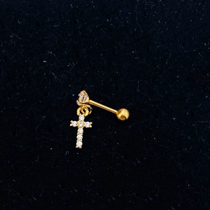 Detailed close-up of a gold stainless steel barbell earring with a zircon cross pendant
